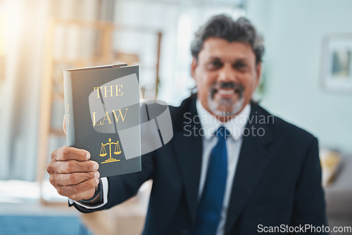Image of Law, book and portrait of a man or lawyer with a book, constitution or research with legal books, study and knowledge. Attorney, judge or businessman with advice in a office, court or consultant