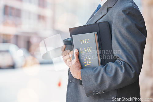 Image of Law, book and businessman or lawyer with legal books, constitution or research on regulation or policy knowledge. Attorney, judge or information on a case in court, government or expert on laws