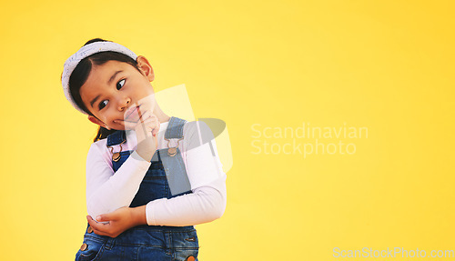 Image of Confused, thinking and kid in doubt, decision and studio isolated on yellow background mockup space. Question, idea and girl child trying to remember memory, solution or choice, why and brainstorming