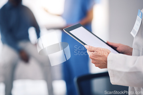 Image of Tablet, hands and doctor with mockup in hospital for healthcare services, surgery data and working in busy clinic. Closeup, medical professional and digital technology screen for planning research