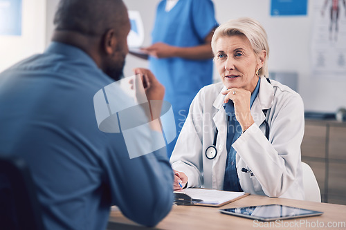 Image of Woman, doctor and talking to patient in consultation for healthcare advice, clinic services and support. Mature medical professional consulting man in hospital for analysis, feedback and test results