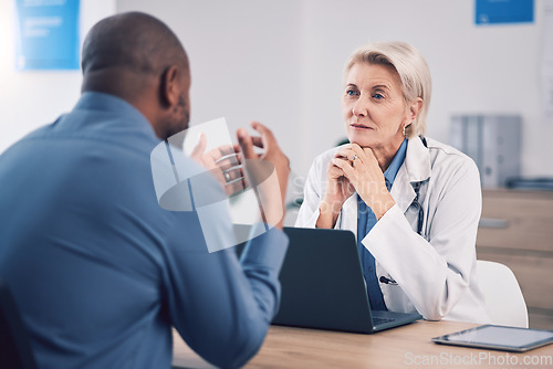 Image of Woman, doctor and listening to man in consultation for healthcare advice at clinic. Mature medical professional consulting with patient for support, wellness services and communication in hospital
