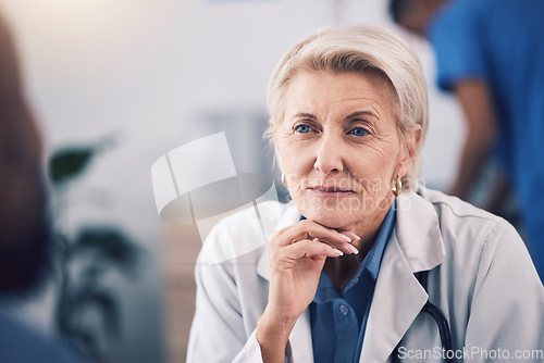 Image of Face of mature woman, doctor and listening in consultation for healthcare support, communication and clinic services. Serious medical therapist consulting patient in hospital for feedback in surgery
