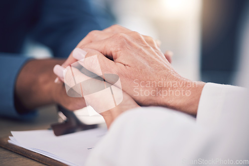 Image of Cancer, empathy and doctor holding hands of patient for care, kindness and hope. Comfort, medical professional and person consulting for wellness, healthcare and help, therapy and support in hospital