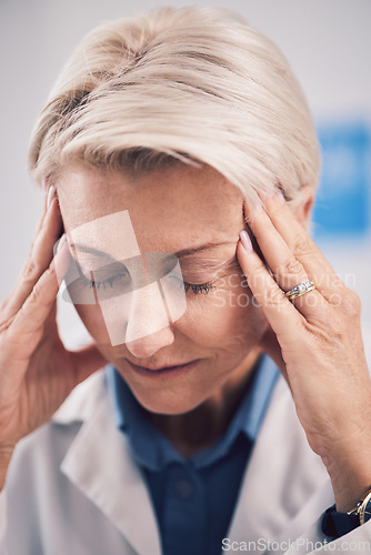 Image of Headache, face of sad doctor and woman with burnout in medical office, mental health problem and pain. Frustrated, tired and mature healthcare worker with fatigue, bad stress and anxiety of challenge