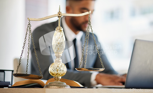 Image of Lawyer, man and laptop with balance scale in office for consultation with research or client. Justice, attorney and tech for information for online agreement for auction with advocate legal contract.