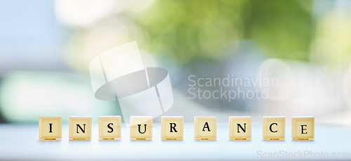 Image of Insurance, word or message on wood blocks or letters writing about life or healthcare in an emergency or accident mockup. Planning for medical, health or banner for security and safety in the future