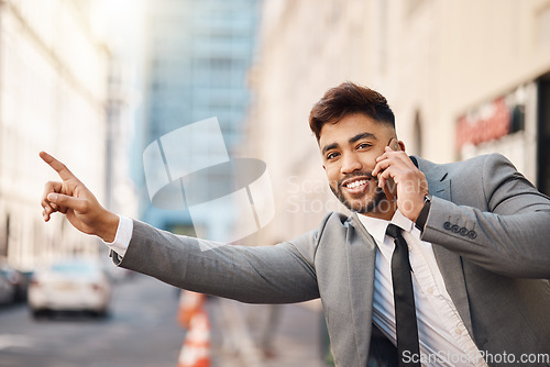 Image of Business man, phone call and stop at taxi, transport and smile with smartphone, booking and city sidewalk. Entrepreneur, phone and pointing for driver, car or chauffeur in metro road, cbd and outdoor