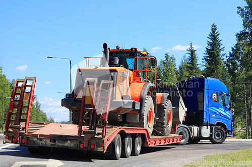 Image of Transporting Doosan DL450 Wheel Loader on Truck Trailer