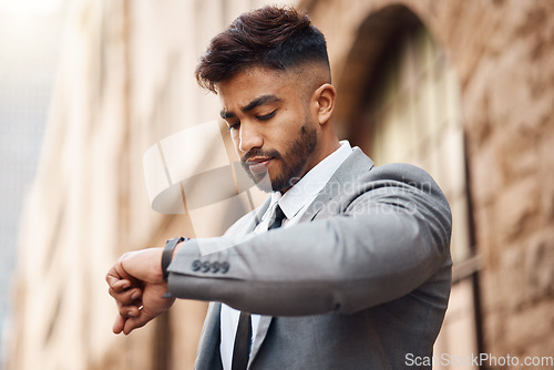 Image of Business man check watch in city for clock, schedule and waiting for appointment, taxi and travel. Indian male worker, corporate employee and wristwatch for time management on urban commute outdoor