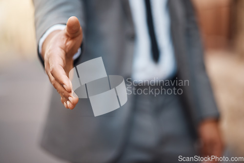 Image of Closeup, business man and offer handshake for introduction, meeting and hello for networking in city. Worker stretching for shaking hands, welcome and thank you for HR recruitment, promotion and deal