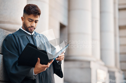 Image of Lawyer man, street and reading documents for case, court battle by city building with information for criminal defence. Young attorney, paperwork and study for litigation, evidence and justice system