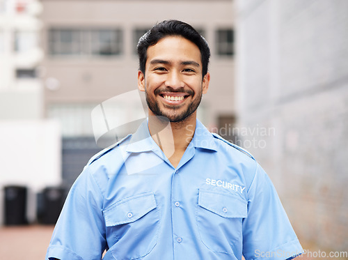 Image of Portrait, man and happy security guard for police service, crime protection and urban safety in city street. Law enforcement, professional bodyguard and asian male officer smile in blue shirt outdoor