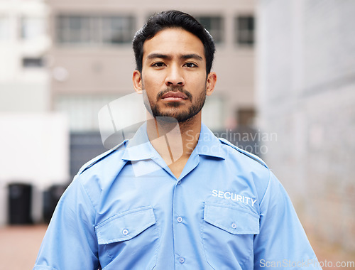 Image of Portrait, man and serious security guard for police service, crime protection and safety in city street. Law enforcement, professional bodyguard and asian male officer in blue shirt outdoor on patrol