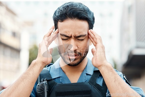 Image of Stress, crisis or policeman in city with headache, anxiety or burnout working for justice or law enforcement. Tired cop, sheriff or security guard with head pain, emergency or migraine on street road