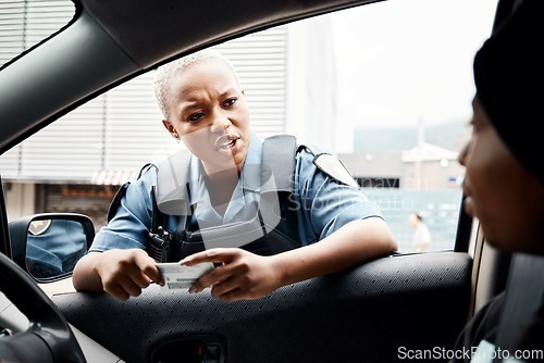 Image of Talking, drivers license or police officer in city to check info for law enforcement, protection or street safety. Black woman, traffic stop or cop on security patrol for road block or crime justice
