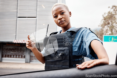 Image of Portrait, drivers license or police officer in city to check info for law enforcement, protection or street safety. Black woman, traffic stop or cop on security patrol for road block or crime justice