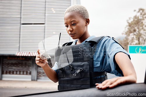 Image of Black woman, drivers license or police officer in city to check info for law enforcement, protection or street safety. Cop, traffic stop or security guard on patrol for road block, crime or justice