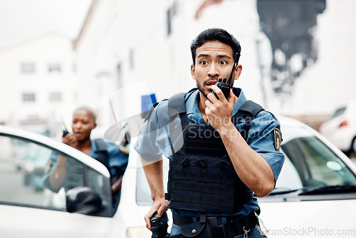 Image of Asian man, police and walkie talkie for suspect in city communication, reinforcement or emergency. Serious male person, security guard or cop radio calling backup for crime in street of an urban town