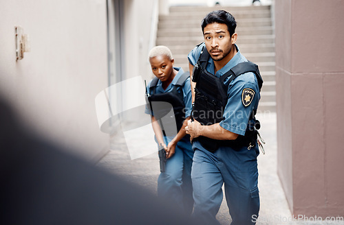 Image of Asian man, police and gun running in city for suspect, investigation or catching criminal together. Serious male person, security guard or cop with partner for backup or crime in alley of urban town