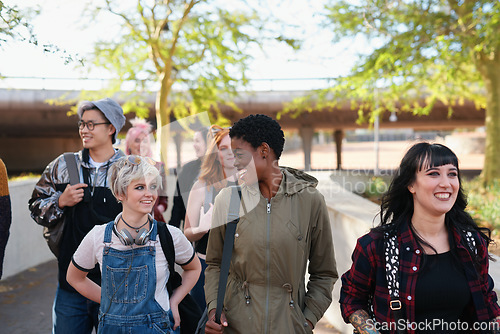 Image of College, campus and group of students walking at university talking and speaking with diversity ready for learning. Happy, education and young gen z people or friends with a scholarship together