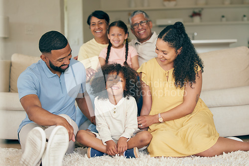 Image of Parents, children and big family in home of love, care and quality time together. Mother, father and portrait of grandparents relax with young kids in lounge for support, smile or bond of generations