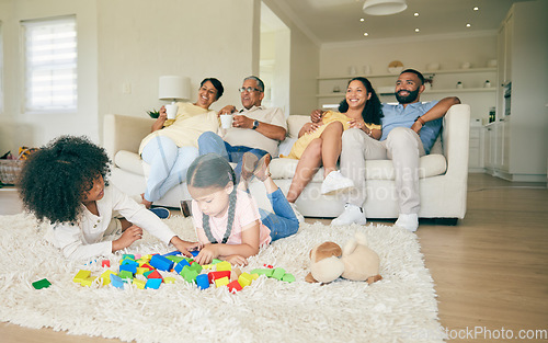 Image of Big family, toys and children playing with parents and grandparents in lounge at home together for creative fun. Living room, happy and development of kids on carpet floor with games by mom and dad
