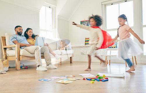 Image of Parents on laptop, happy family and running children playing pretend games, fun or imagine being superhero, princess or ballerina. Speed energy, Halloween fantasy costume and young kids play at home