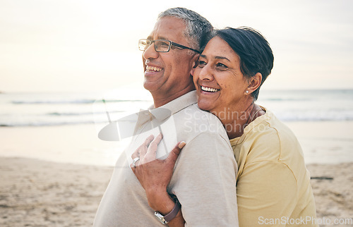 Image of Love, hug and senior couple at beach happy, relax and bond in nature together. Ocean, embrace and old people hugging at the sea for travel, vacation and enjoy retirement with holiday, freedom or trip