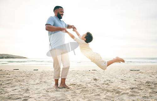 Image of Freedom, father and boy child at a beach with swing, fun and game while bonding in nature together. Love, ocean and parent playing with kid at the sea for travel holiday and vacation in Cancun