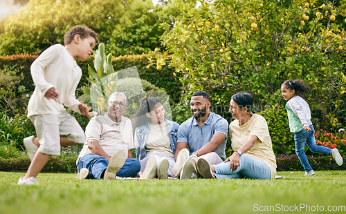 Image of Picnic, playing children and happy family relax, have fun or enjoy outdoor quality time together, nature and wellness. Summer freedom, grass and bonding grandparents, parents and kids running in park