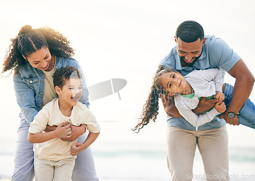 Image of Happy, vacation and family at the beach, playing and bonding outdoor in nature together. Smile, love and children with parents and the sea for holiday, travel and relax, freedom and games in Cancun