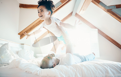 Image of Man, young girl in air and games in bedroom, airplane and care free with bonding, love and happiness at family home. Father lifting daughter, playing together with fun and playful, trust and flying