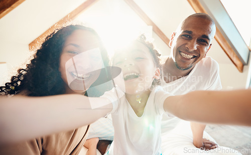 Image of Family, funny and face selfie in house, bonding and laughing together with sunshine lens flare. Portrait, happy or girl with father, mother and parents with profile picture for memory on social media