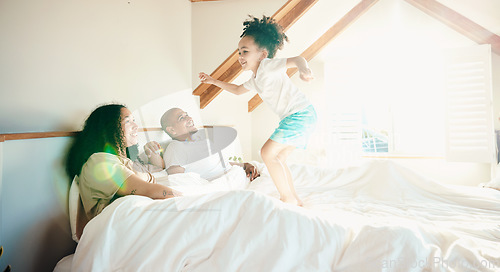 Image of Kid, jump and bed with parent with happiness for bonding with games on weekend for fun in home. Playful, energy and girl with family in morning for quality time with excited child and wake up.