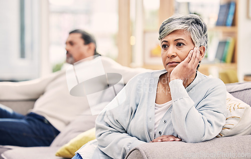 Image of Senior couple, divorce and fight in conflict, argument or disagreement on living room sofa at home. Elderly man and woman in stress, depression or toxic relationship for cheating affair or breakup