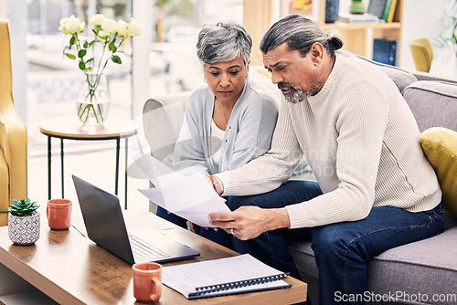 Image of Documents, laptop and senior couple planning, finance paperwork and retirement funding or loan at home. Sofa, life insurance and asset management of elderly woman and man of bills or debt on computer