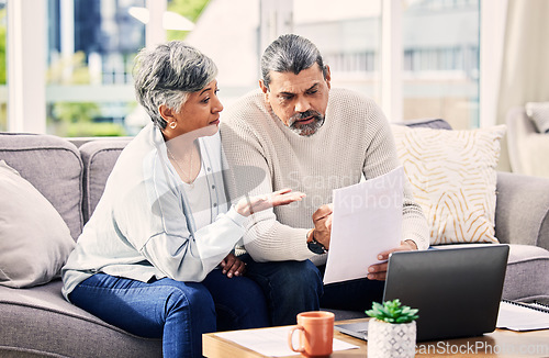 Image of Old couple, laptop and discussion about retirement paperwork, life insurance and finance investment at home. People do taxes online, pension policy documents and budget, woman and man with bills