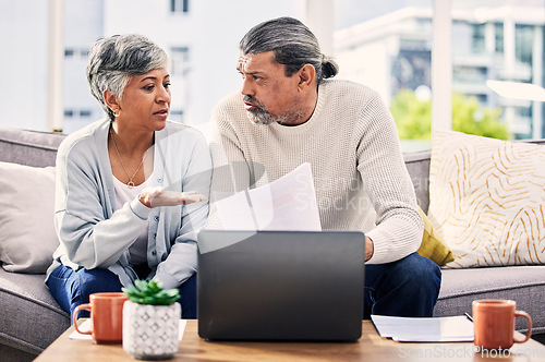 Image of Senior couple, documents and stress on laptop with financial paperwork, taxes or retirement questions at home. Planning, debt and elderly people on sofa for life insurance, bills or asset management