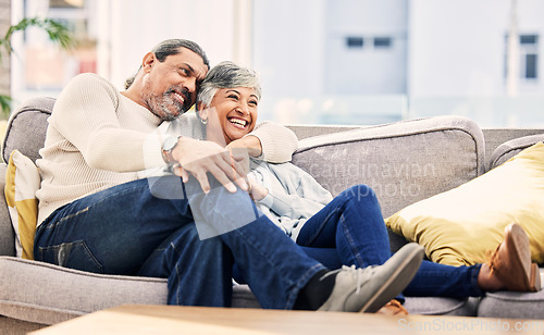 Image of Home, happy and senior couple on a couch, love or relax with happiness, marriage or watching tv. Romantic, old woman or mature man on a sofa, relationship or smile with quality time and retirement
