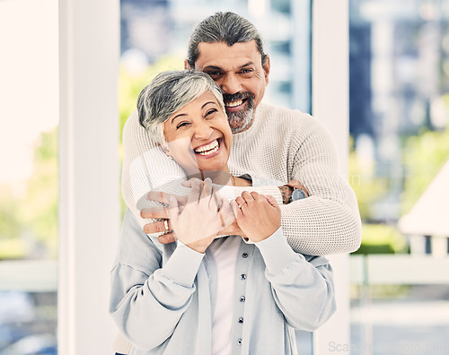 Image of Funny, portrait and elderly couple hug in home, laugh and relax in retirement together. Face, embrace and senior man and woman smile for love, care and support, commitment and loyalty in marriage.