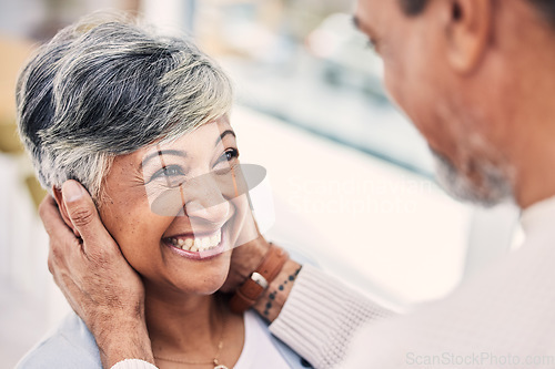 Image of Senior, happy or old couple in living room with love, care or joy bonding together on holiday at home. Eye contact, elderly man or mature woman in celebration for anniversary romance in retirement