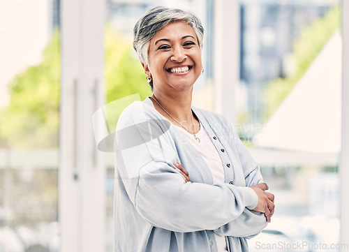 Image of Portrait, happy and senior woman with arms crossed in house for positive mindset, relax in retirement home and joy. Face, smile and elderly female person from India with confidence in casual clothes.