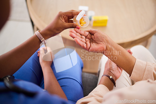 Image of Woman, hands and nurse with pills for patient in elderly care, support or trust at old age home. Closeup of female person, medical or healthcare caregiver giving medication to senior for cure or dose