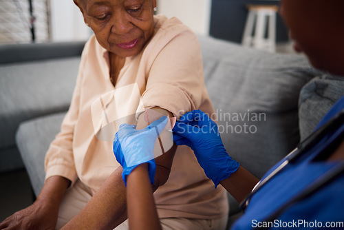 Image of Senior woman, doctor and plaster for arm vaccine, medical and healthcare treatment for virus safety, flu and wellness. Patient, elderly person or nurse hands with injection bandage in retirement home