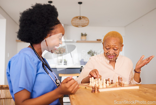 Image of Nurse playing chess with a mature woman after a healthcare consultation in nursing rehabilitation center. Board game, conversation and female caregiver bonding with elderly patient in retirement home