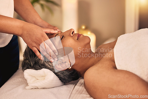 Image of Woman, head massage and spa for beauty, skincare detox and healing zen therapy at cosmetic salon. Face, calm and mature female client relax for wellness, reiki and facial acupressure with beautician