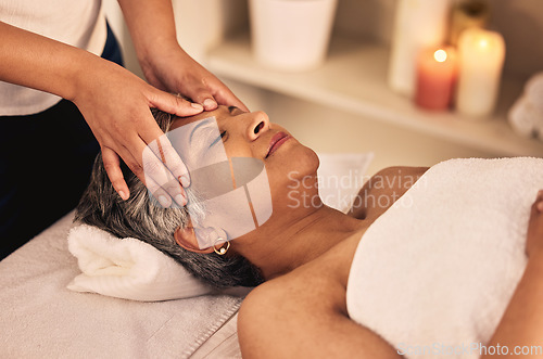 Image of Woman, face and head massage at spa with beauty therapist, skincare treatment and healing at cosmetics salon. Calm, relax and mature female client at wellness resort for reiki and facial acupressure