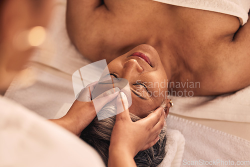 Image of Woman, relax and spa for head massage, skincare detox or holistic zen therapy at beauty salon from above. Face, calm and mature female client at wellness resort for reiki, peace or facial acupressure