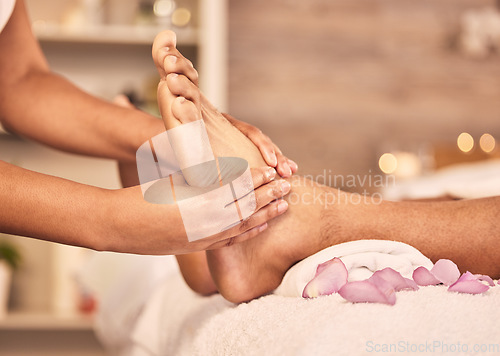 Image of Closeup, feet and spa with a massage, relax and skincare with wellness, calm and stress relief. Zoom, barefoot and client with luxury, health or treatment with grooming, cosmetic service or self care